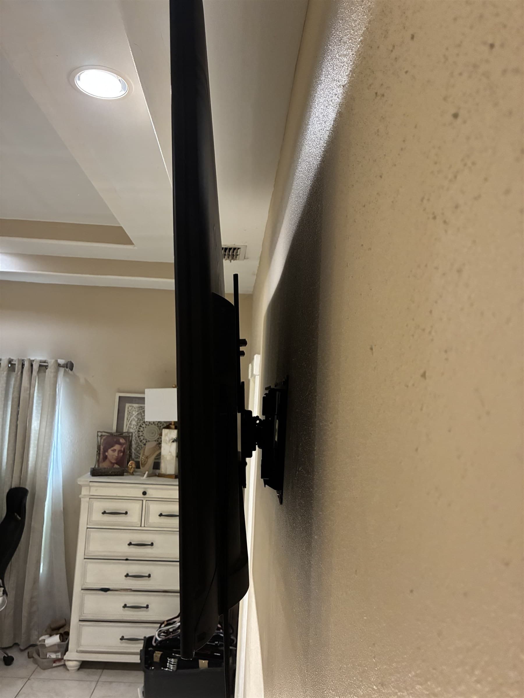 Wall mount hardware installed for TV mounting project